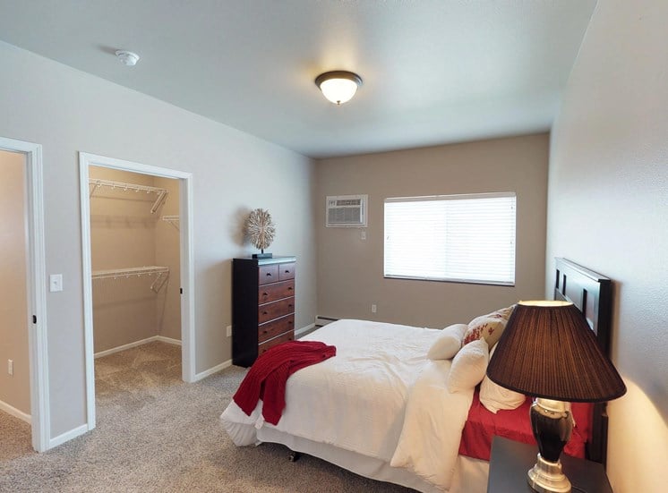 bedroom with dresser and bed, moorhead apartment